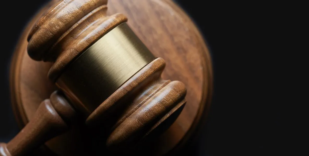 A close up of the side of a judge 's gavel.